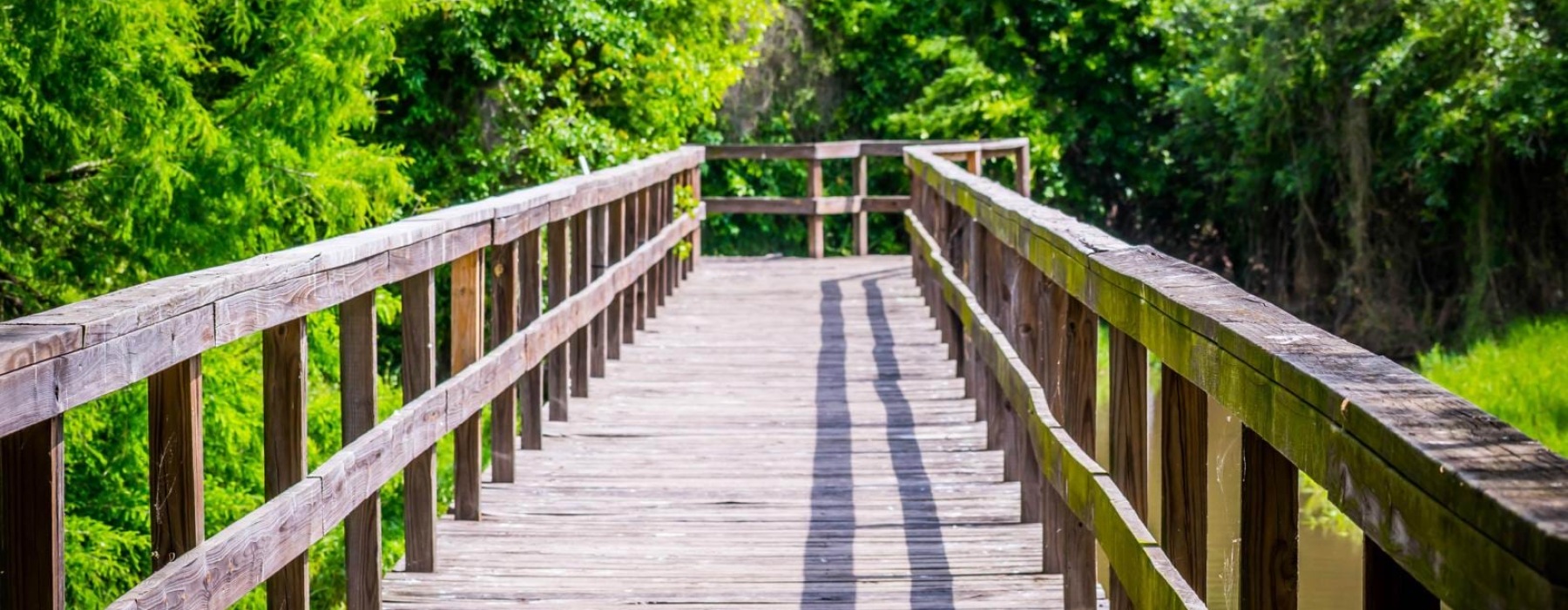 a wooden bridge with railings