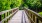 a wooden bridge with railings