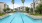 a pool with a building in the background