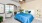 a bedroom with a bed and a fan