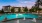 a pool in front of a house