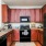 a kitchen with wooden cabinets